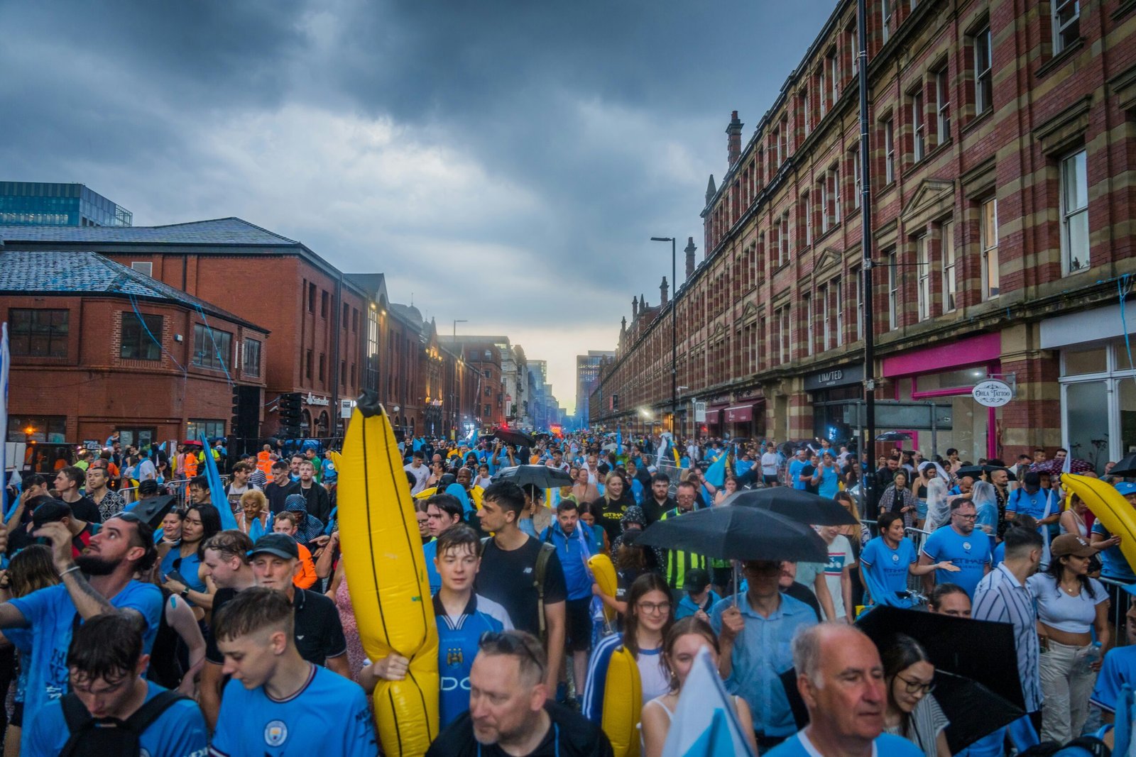 a large group of people walking down a street