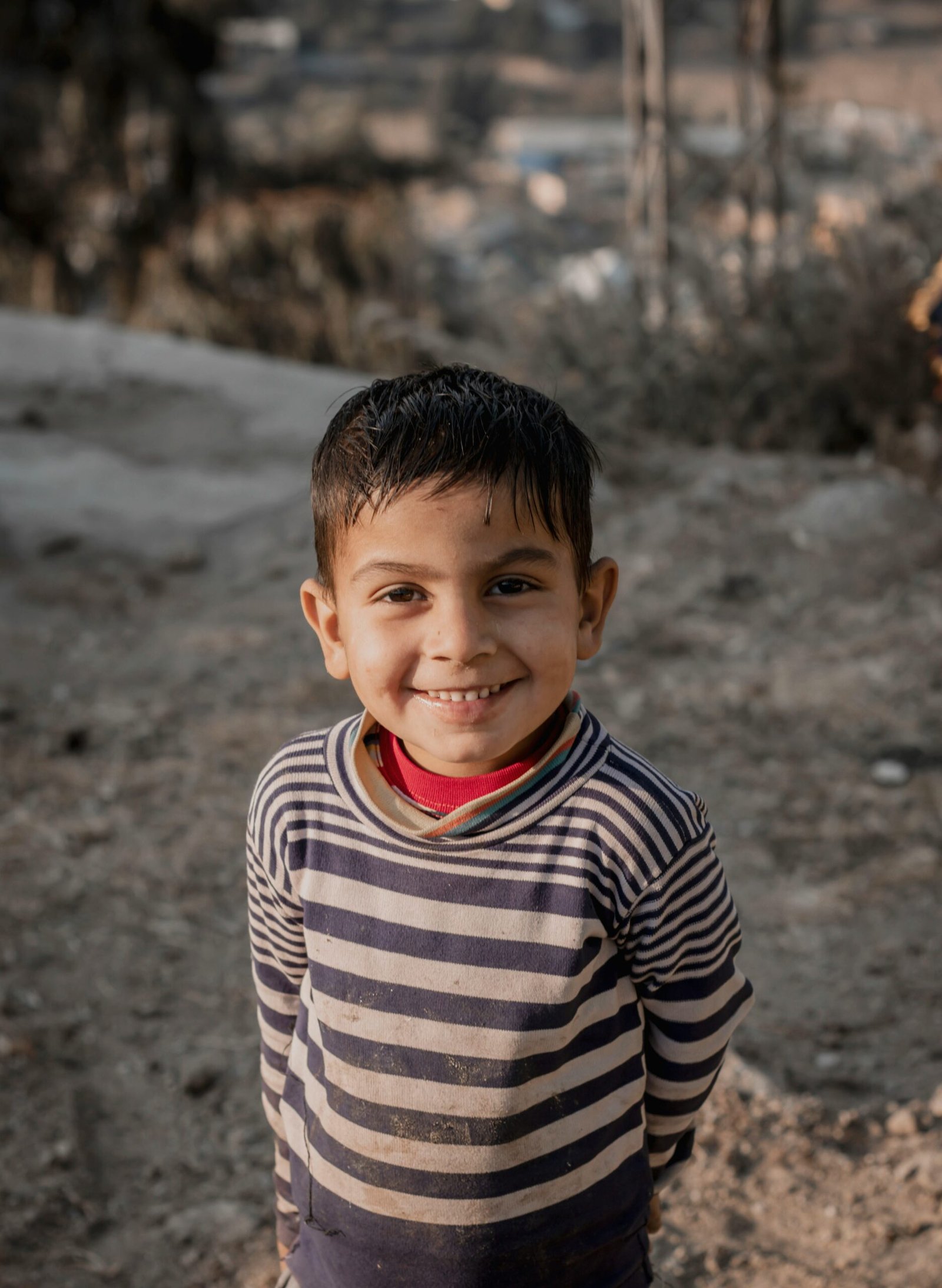 boy in black and white striped long sleeve shirt