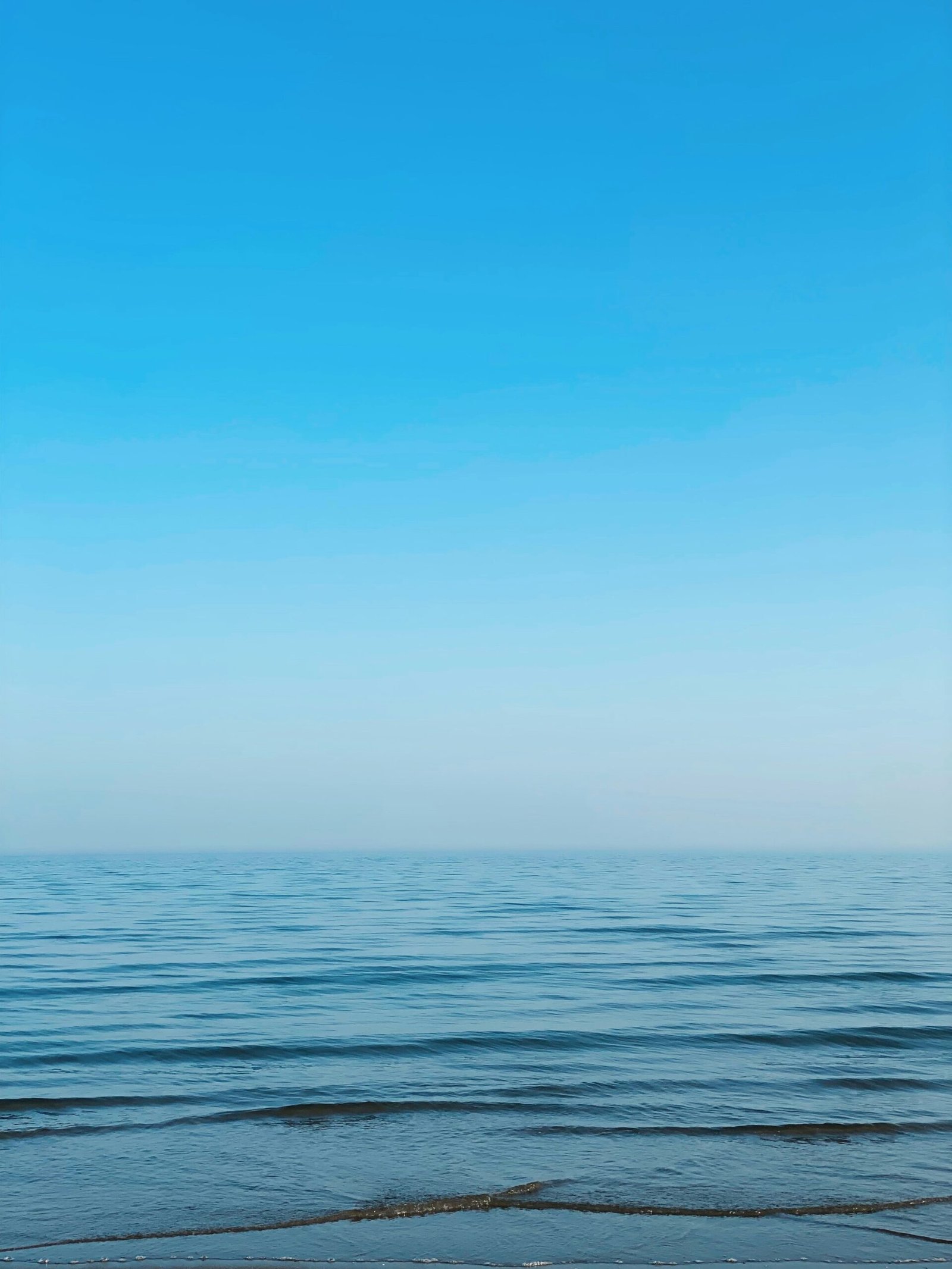 a beach with blue sky